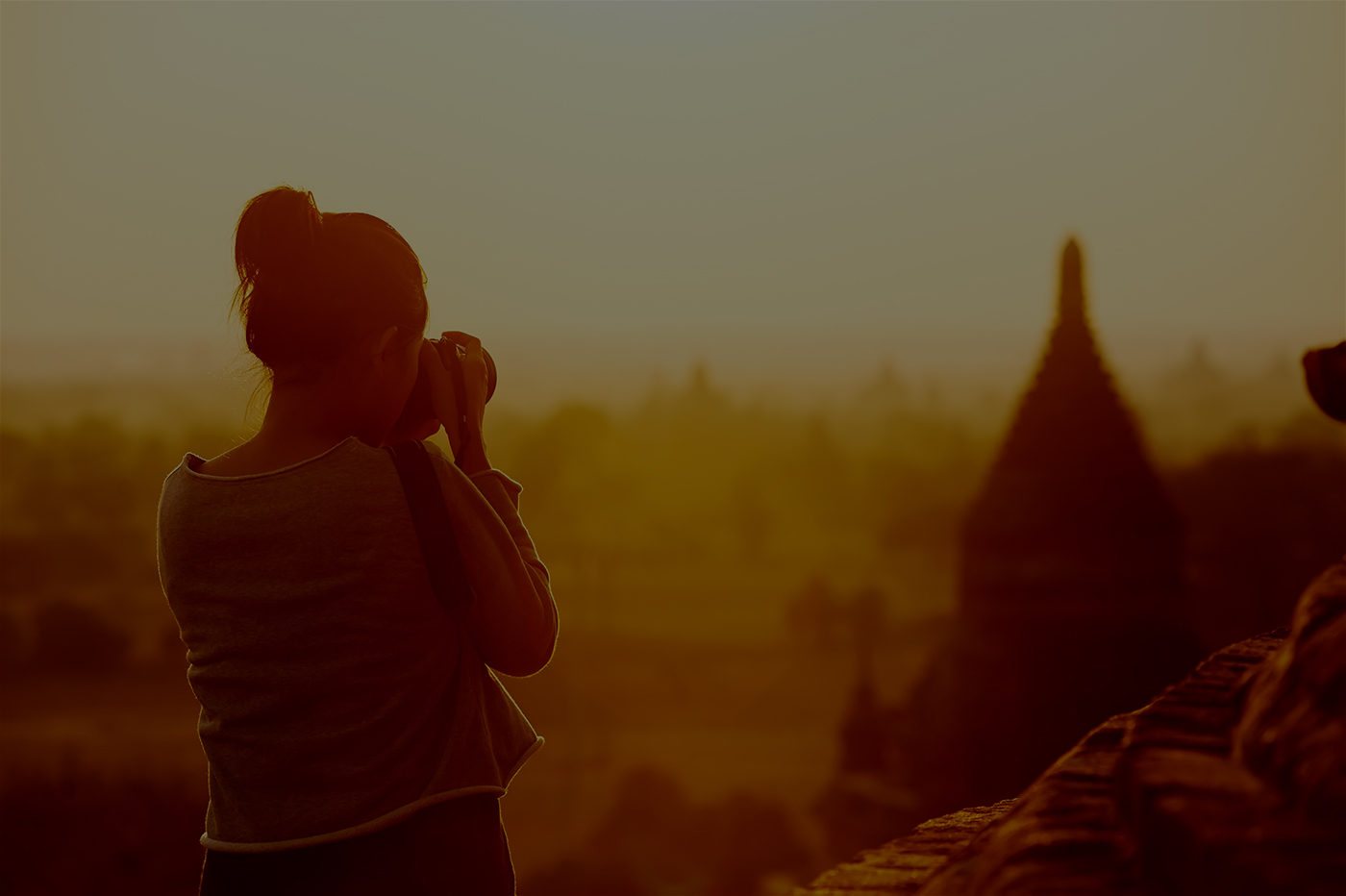 Traveler taking a photo of landmark