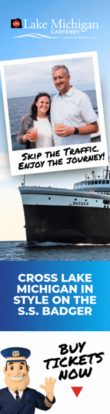 Skyscraper display ad. A couple photographed on deck above the S.S. Badger at sea, with the handwritten line Skip the Traffic, Enjoy the Journey and a captain waving beside Buy Tickets Now.